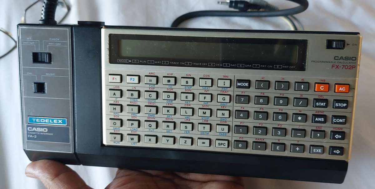 FOR THE COLLECTOR CASSIO BUNDLE FX-702P CALCULATOR AND CASSIO CASSETTE INTERPHASE BOTH WORK TOGETHER
