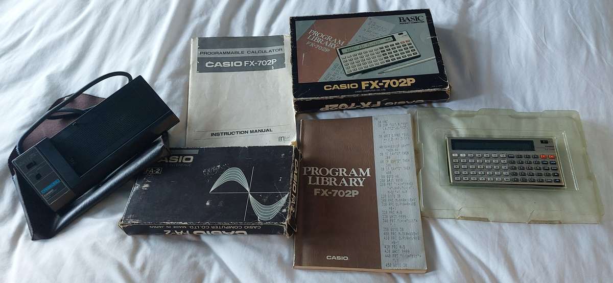 FOR THE COLLECTOR CASSIO BUNDLE FX-702P CALCULATOR AND CASSIO CASSETTE INTERPHASE BOTH WORK TOGETHER