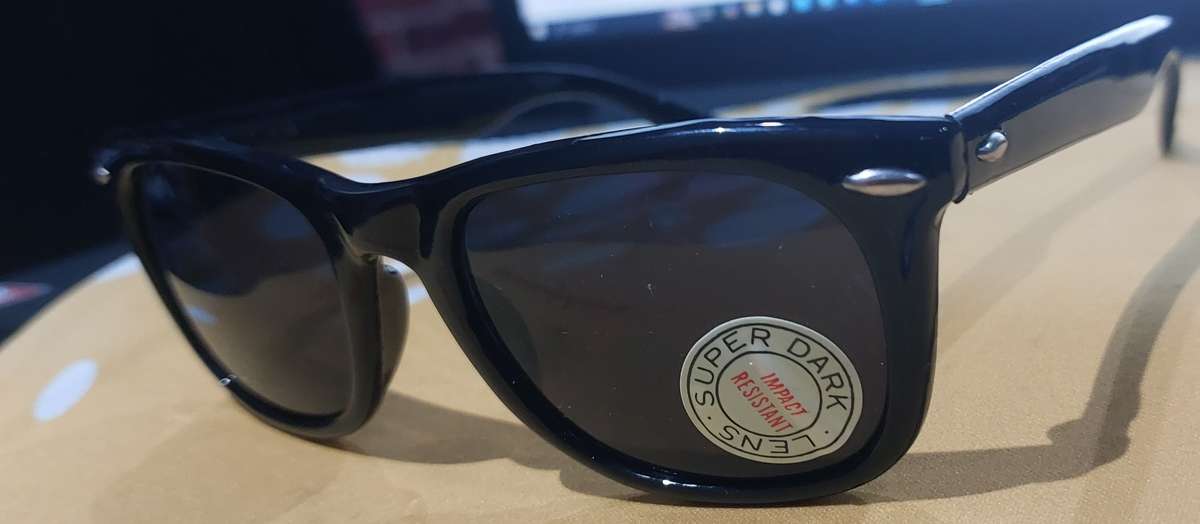 super dark  SUN GLASSES money back guarantee