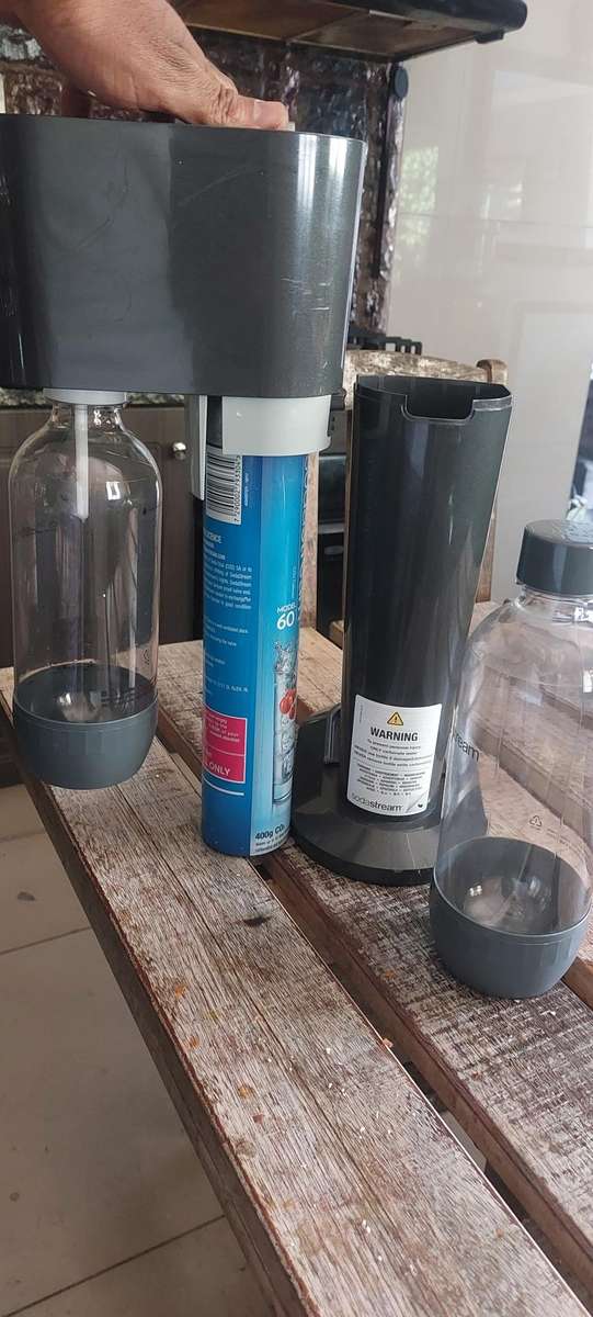 like new sodastream genesis machine included gas and bottle x 2 (still has gas in tank)