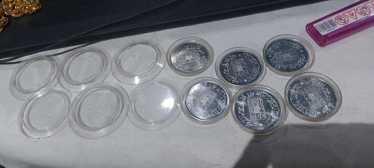 coins in capsule unsure what these are bid for the lot