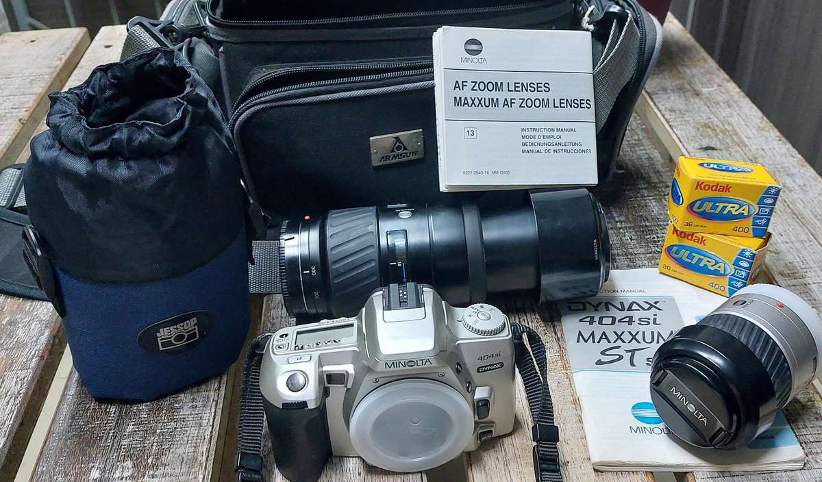 top condition made in Japan minolta camera with huge zoom lens incl jessop lens case and 2 box film