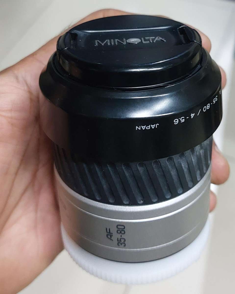 top condition made in Japan minolta camera with huge zoom lens incl jessop lens case and 2 box film