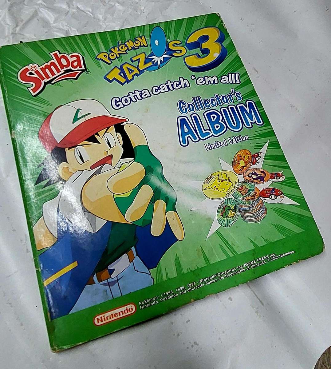 pokemon collectors album with tazzos inside not complete