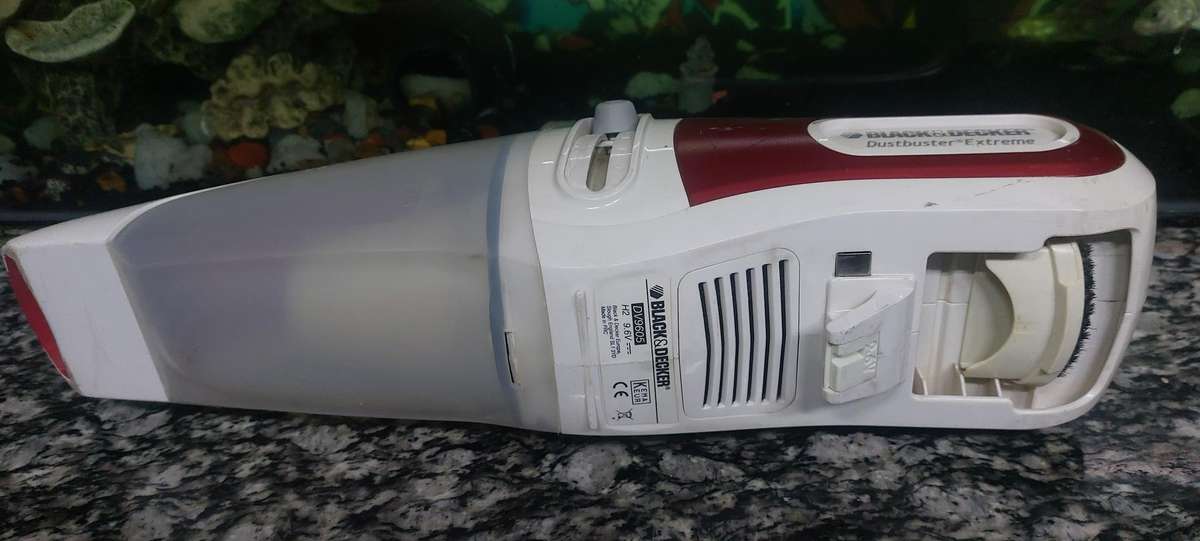 rechargeable black and decker dust buster with charger and docking unit.