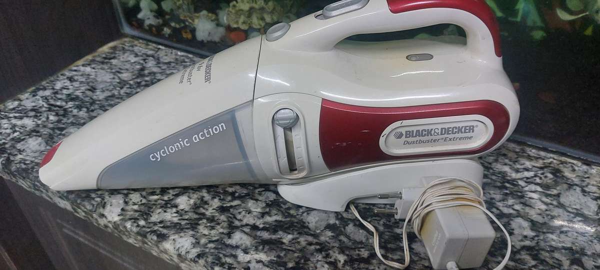 rechargeable black and decker dust buster with charger and docking unit.