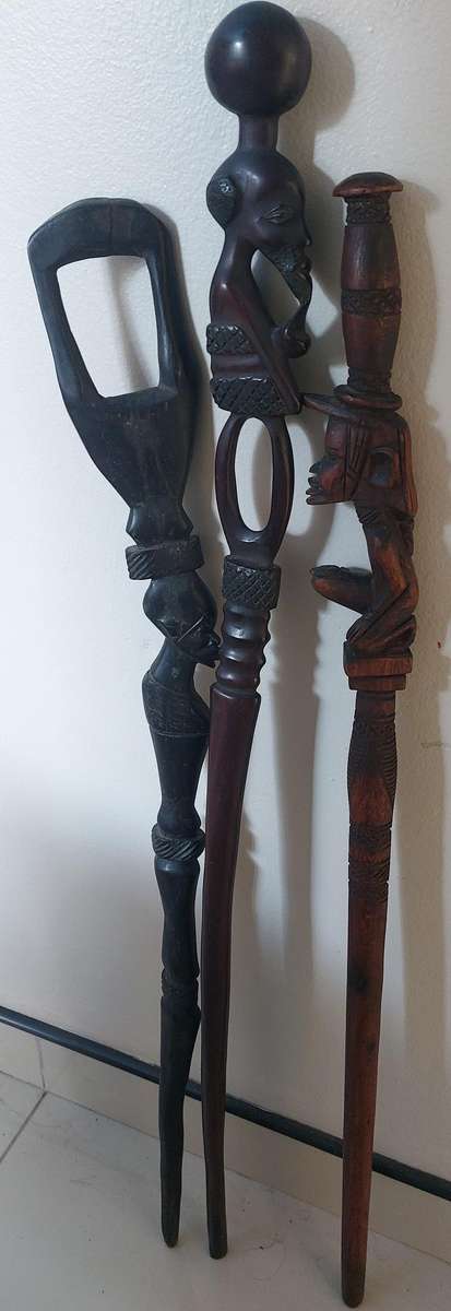 vintage solid wood carved walking sticks bid for the lot