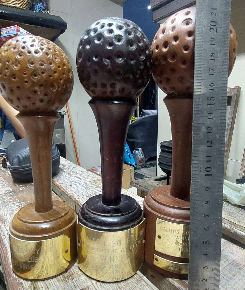 Vintage very heavyvhand carved wood golf trophies bid for all