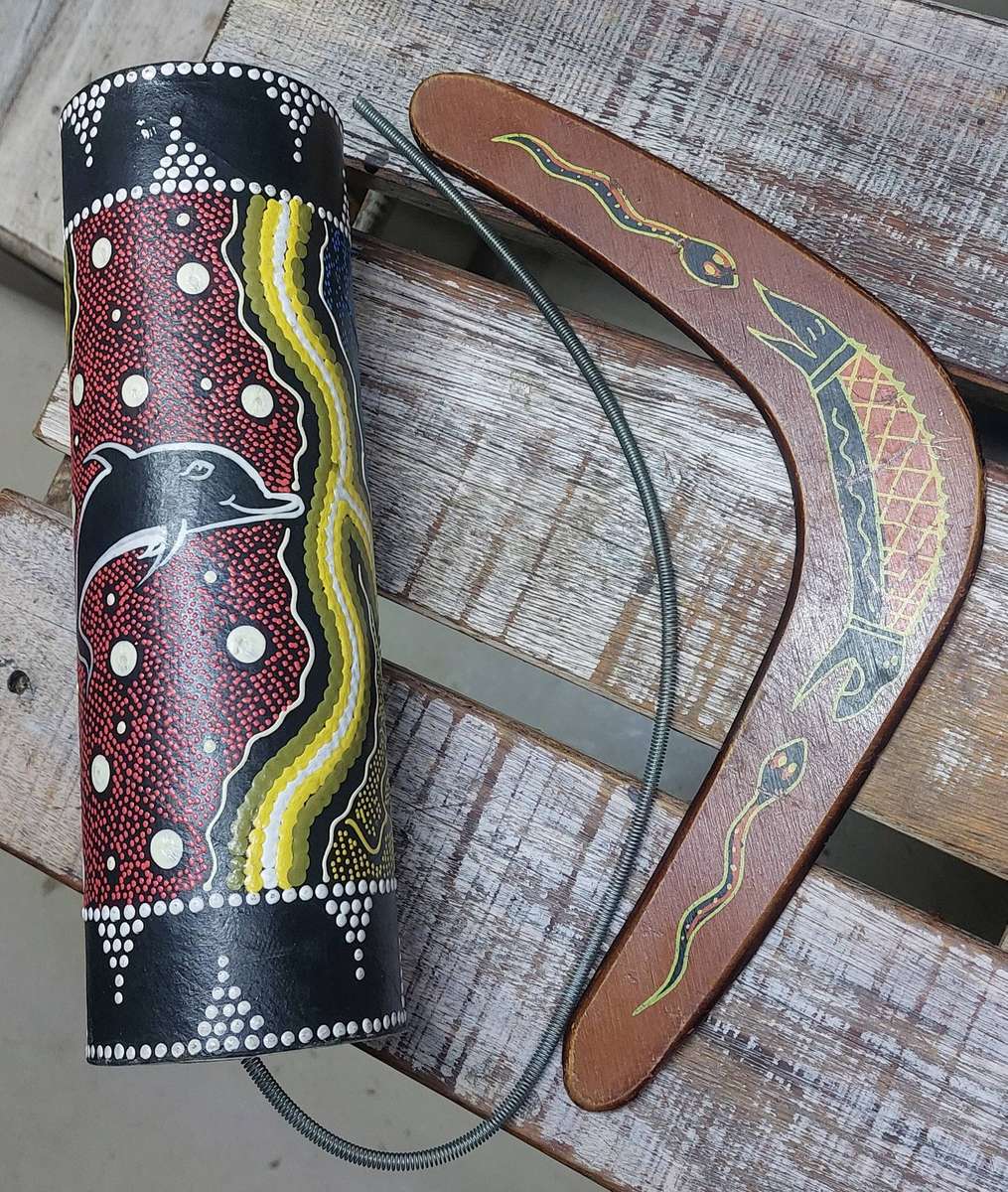 Authentic boomerang and aborianese thunder drum mimics the sound of thunder storm