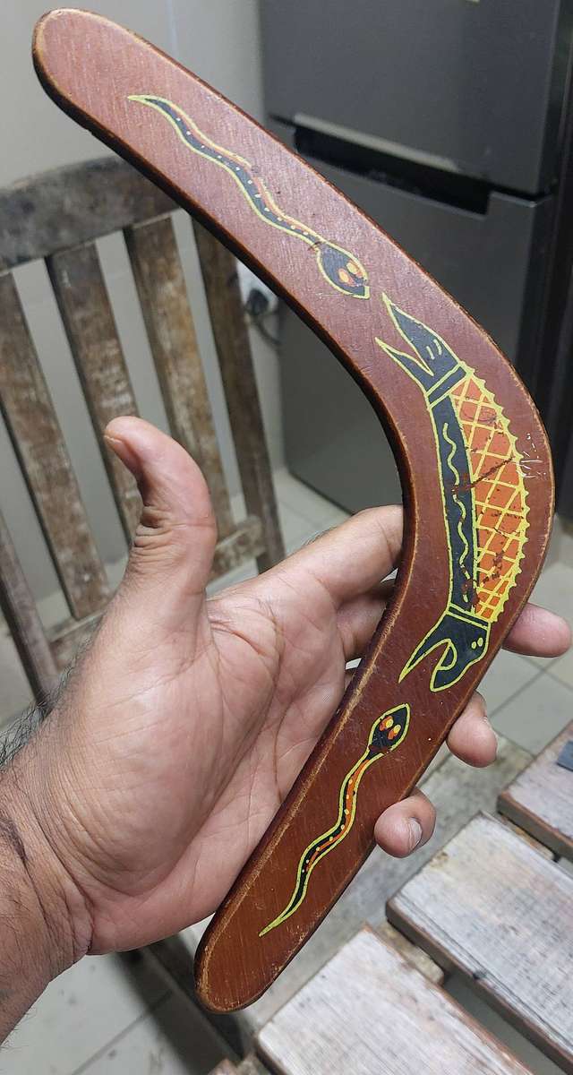 Authentic boomerang and aborianese thunder drum mimics the sound of thunder storm