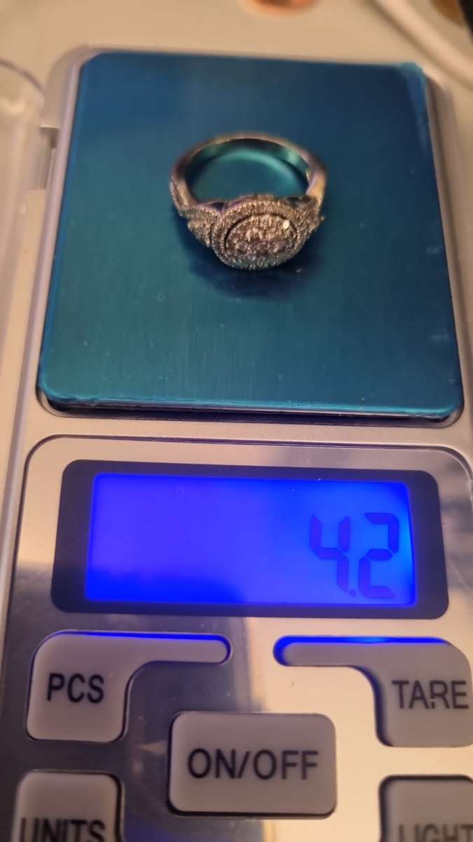 Round cut halo diamond ring