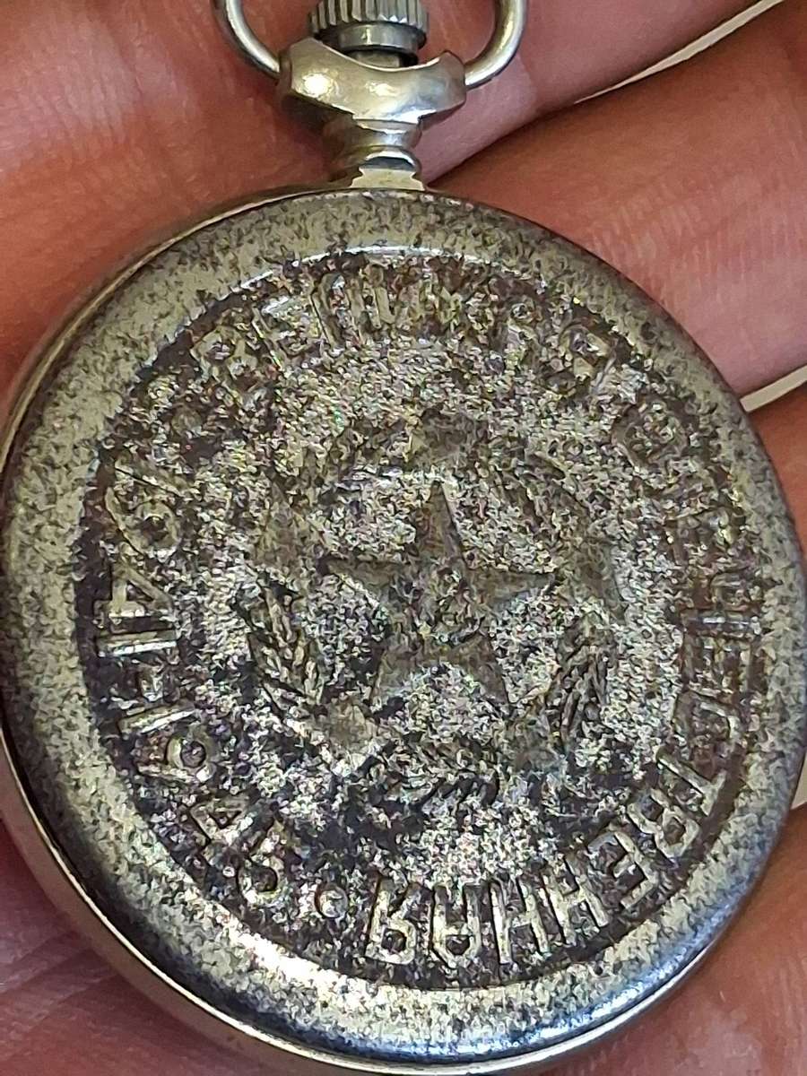 Vintage world war 2 pocket watch and  badges winds