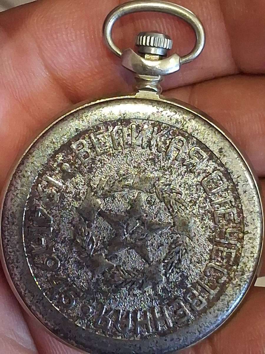 Vintage world war 2 pocket watch and  badges winds