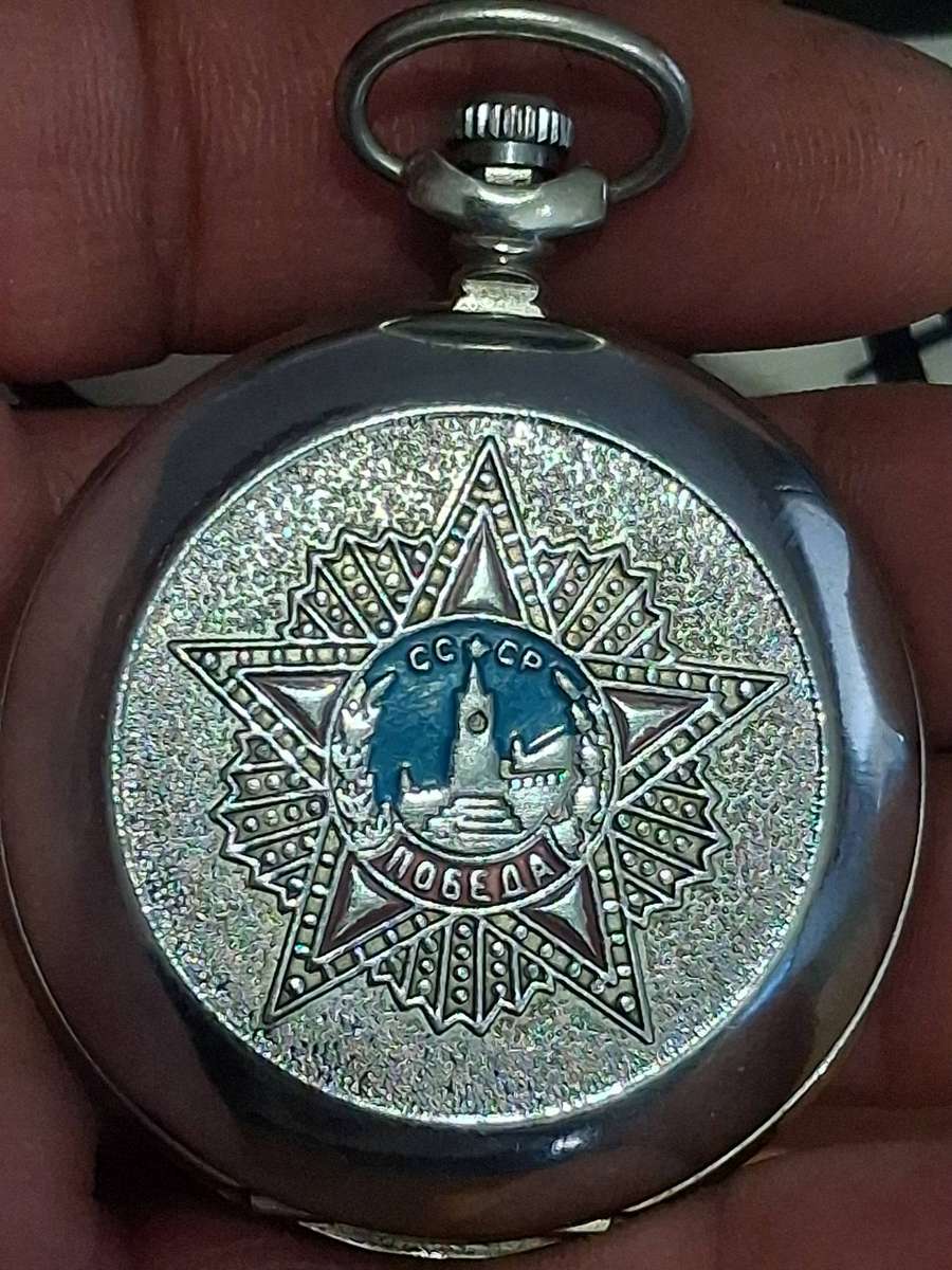 Vintage world war 2 pocket watch and  badges winds