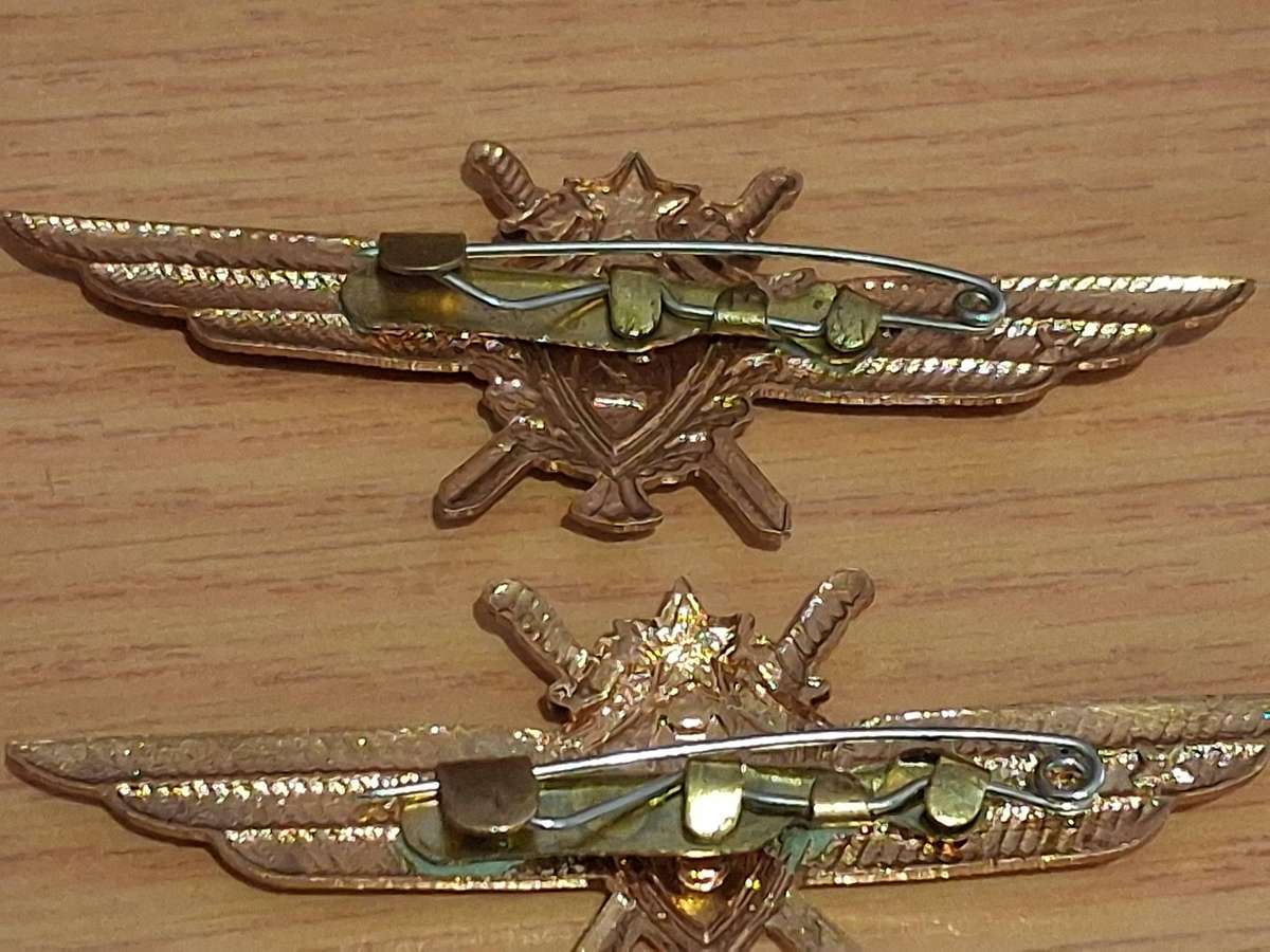 Vintage world war 2 pocket watch and  badges winds