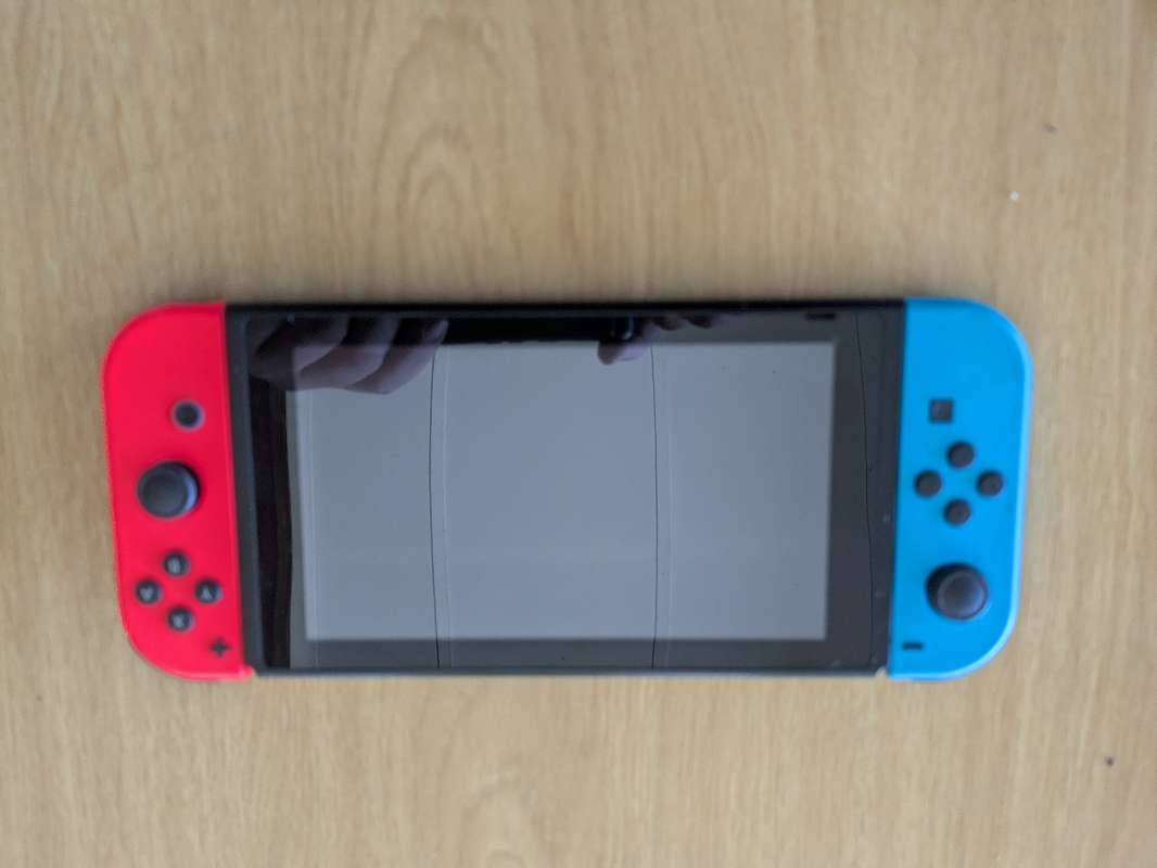 Nintendo Switch V2 Console**Case and universal Charger**Dock