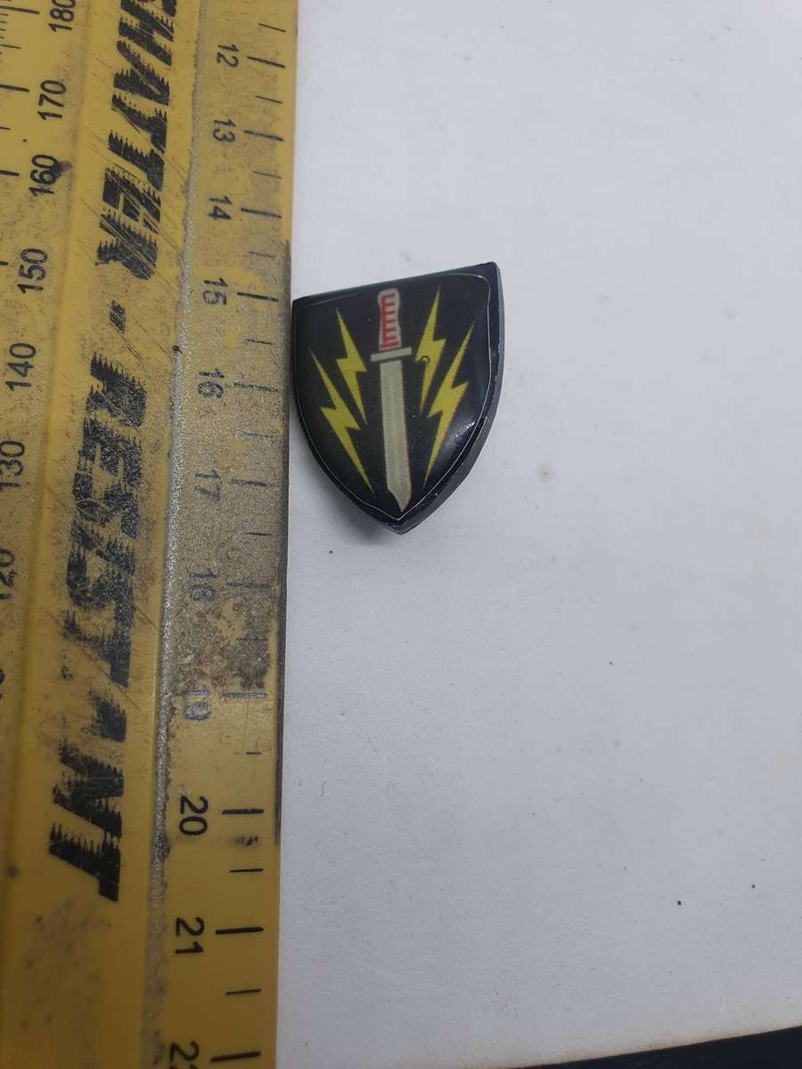 61 Meg Breast Pin. Origin Unknown 2 cm