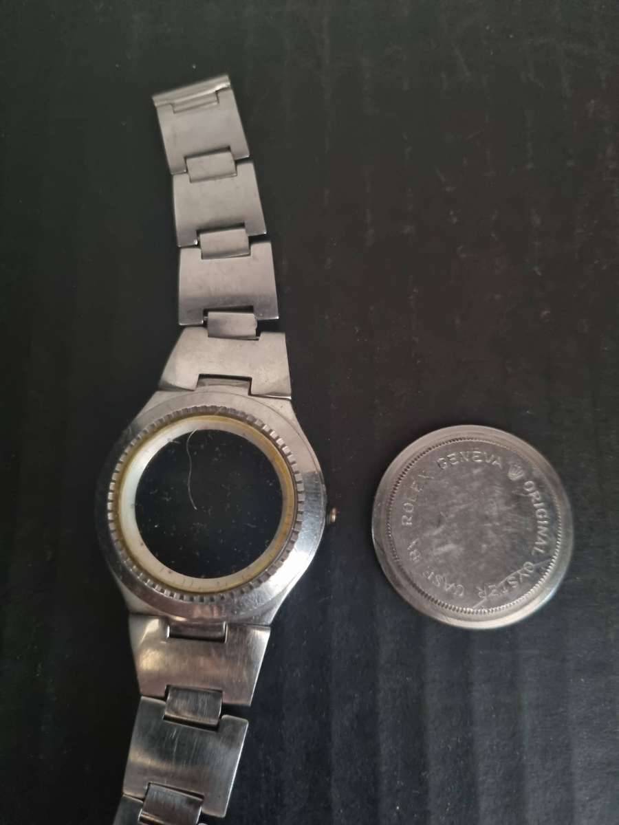 Original Rolex Casing and back plate.  With Tudor watch bezel. Money back guarantee. No Movement.