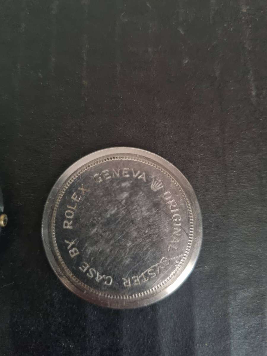 Original Rolex Casing and back plate.  With Tudor watch bezel. Money back guarantee. No Movement.