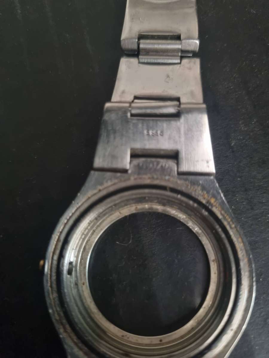 Original Rolex Casing and back plate.  With Tudor watch bezel. Money back guarantee. No Movement.