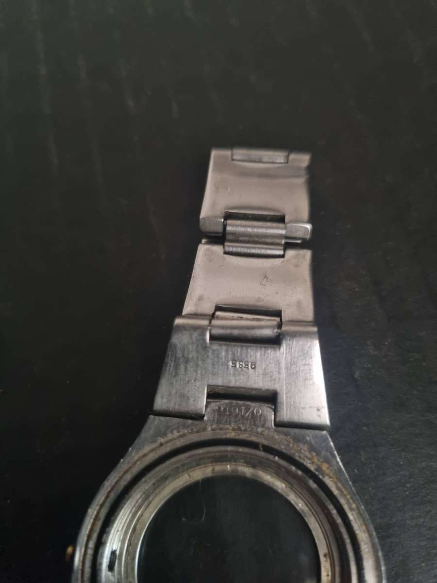 Original Rolex Casing and back plate.  With Tudor watch bezel. Money back guarantee. No Movement.