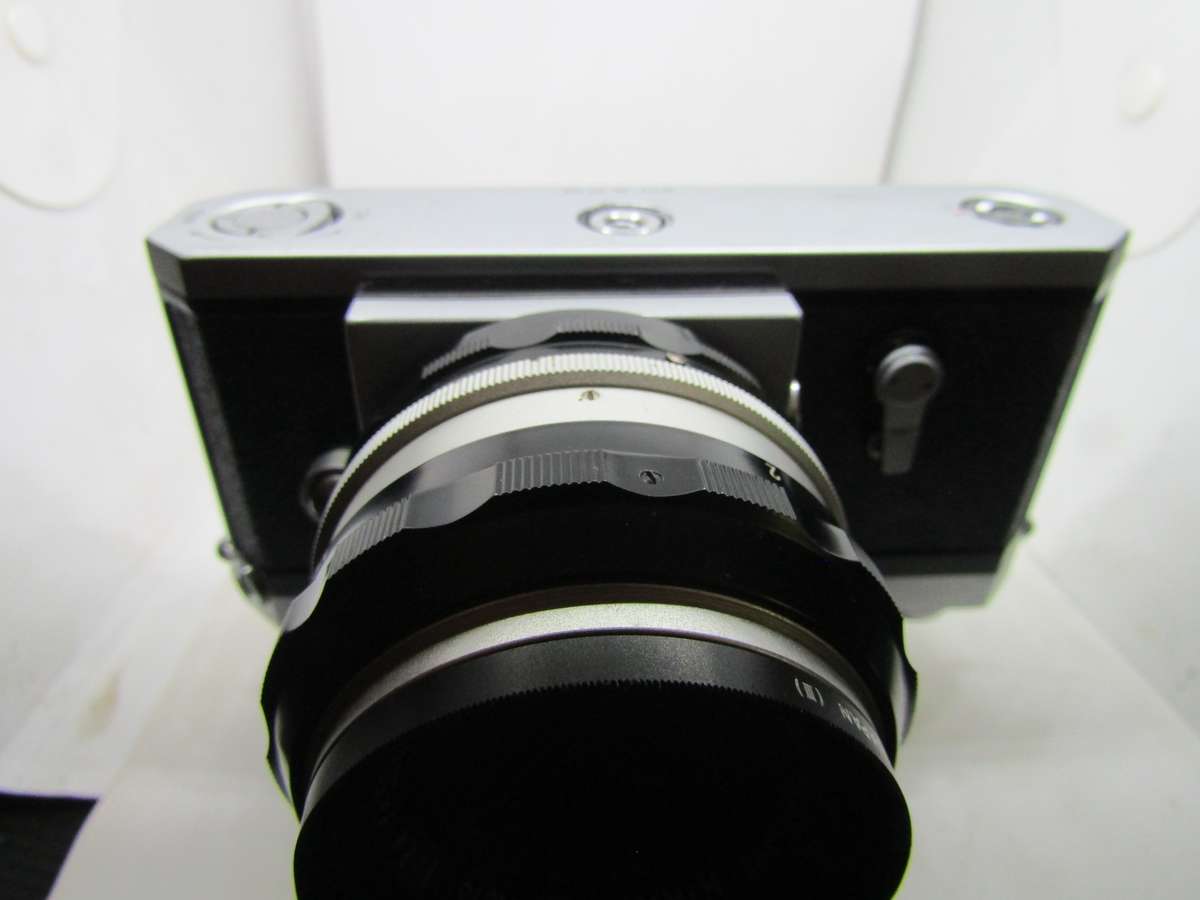 Chrome Nikon F 35mm film slr camera photomic meter nikkor-h 1:2 f50mm kogaku lens. Immaculate. Work