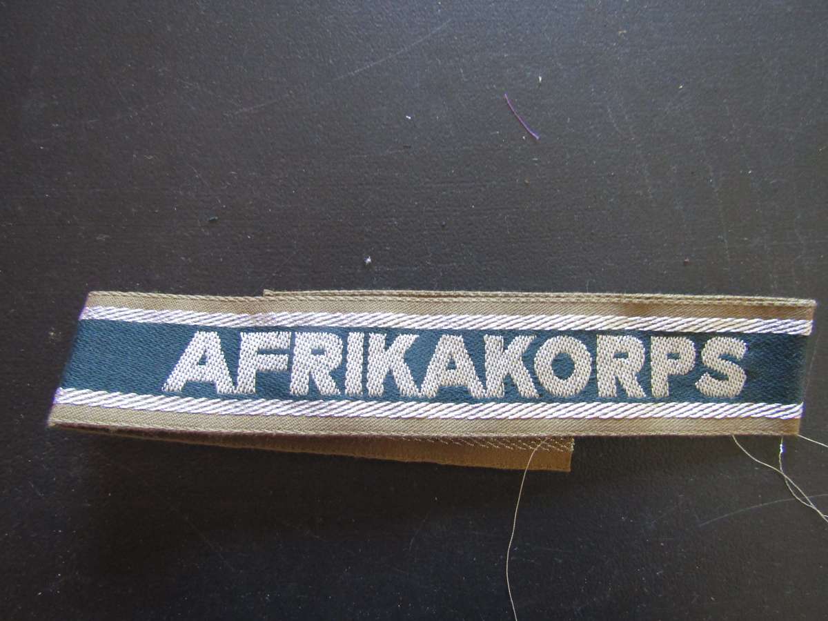 Germany, Third Reich. Unissued  Afrika Korps (GAC) Cuff Tittle Think is a reproduction. Not Sure.