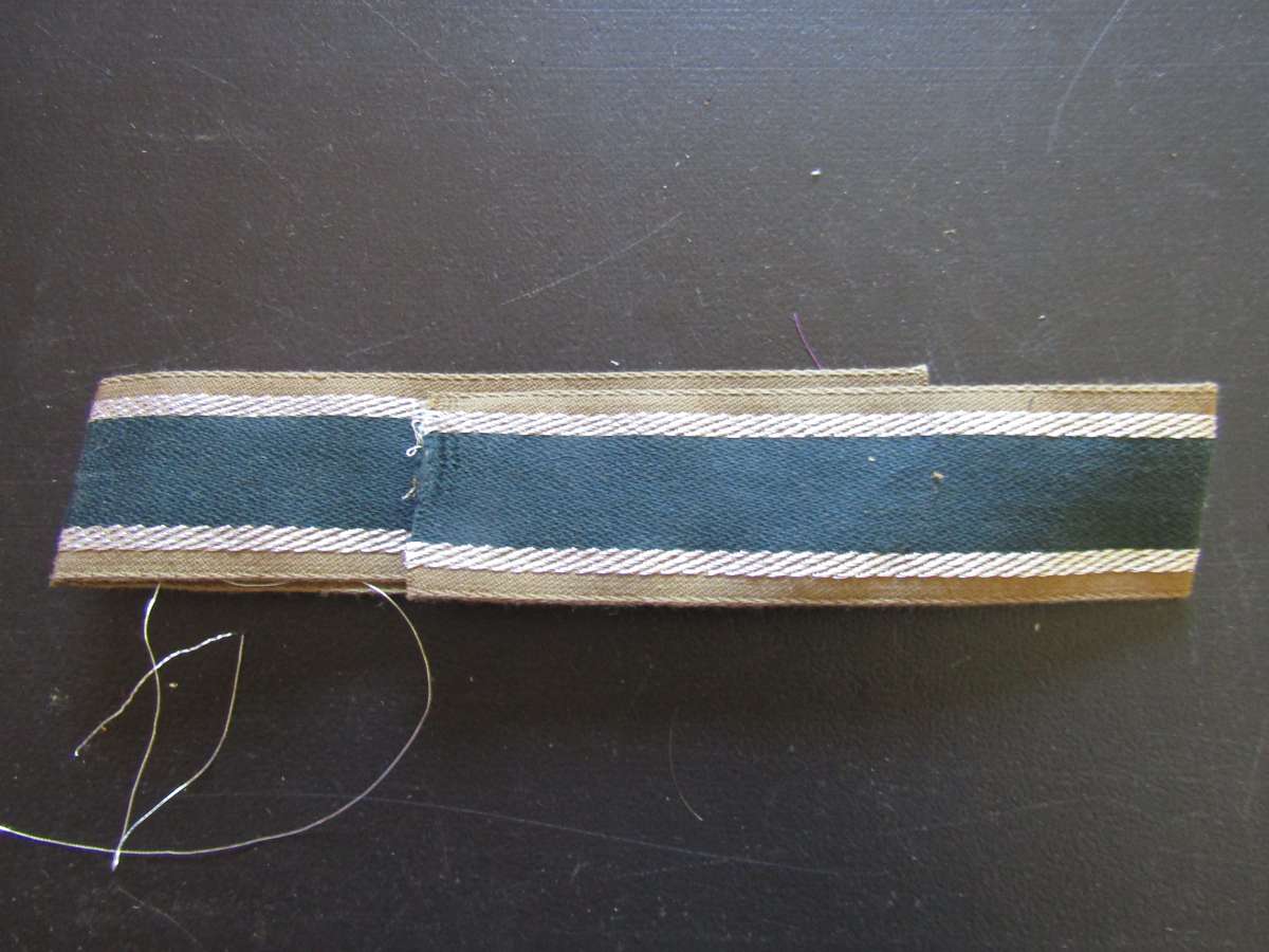 Germany, Third Reich. Unissued  Afrika Korps (GAC) Cuff Tittle Think is a reproduction. Not Sure.