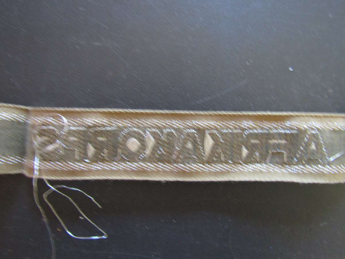 Germany, Third Reich. Unissued  Afrika Korps (GAC) Cuff Tittle Think is a reproduction. Not Sure.