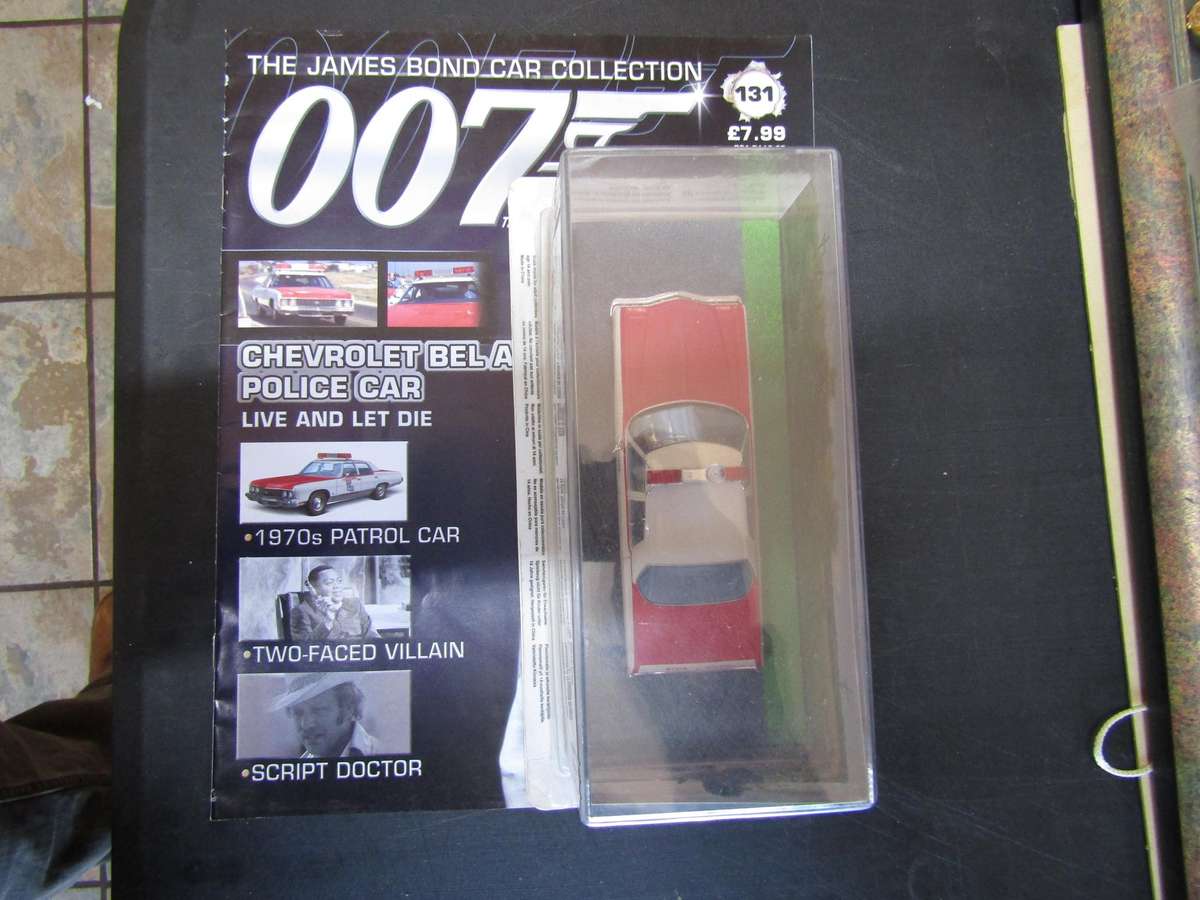 007 Chevrolet Bel Air Police Car - Live and let die - scale 1/43. Sealed. With Book Nr 131