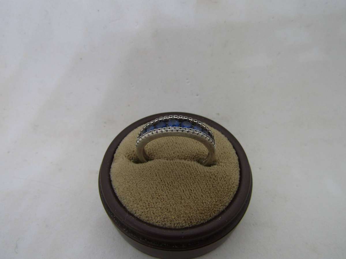 Sterling Silver women's ring with blue stones. size 13 box not incl