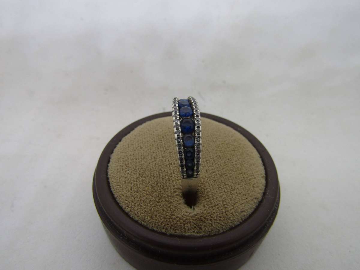 Sterling Silver women's ring with blue stones. size 13 box not incl