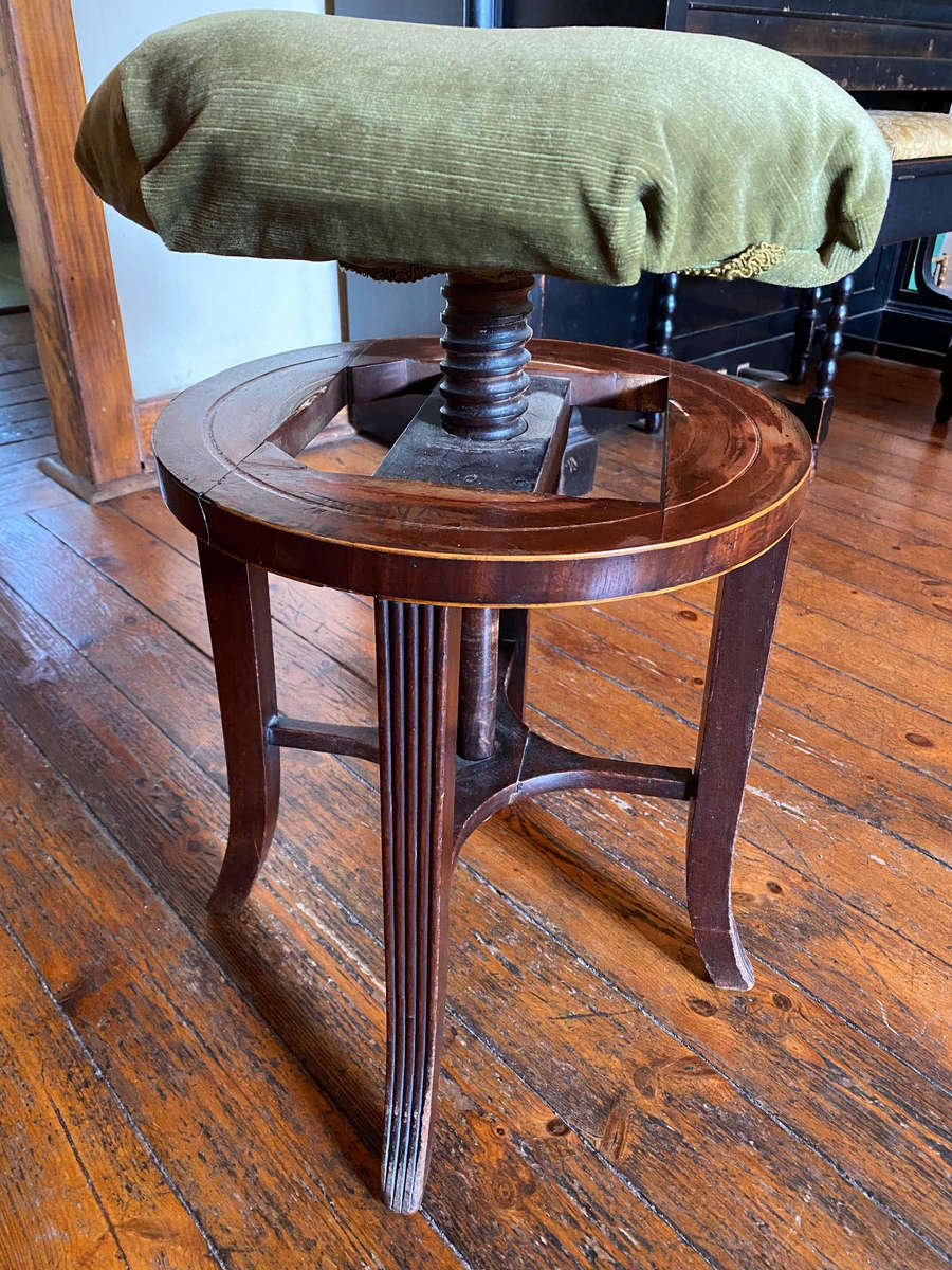 A Victorian mahogany adjustable circular piano stool