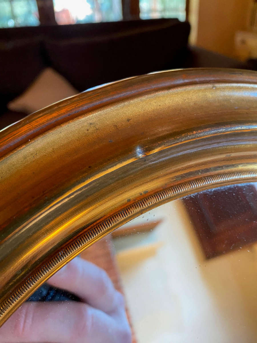 EDWARDIAN OVAL BRASS-FRAMED WALL MIRROR