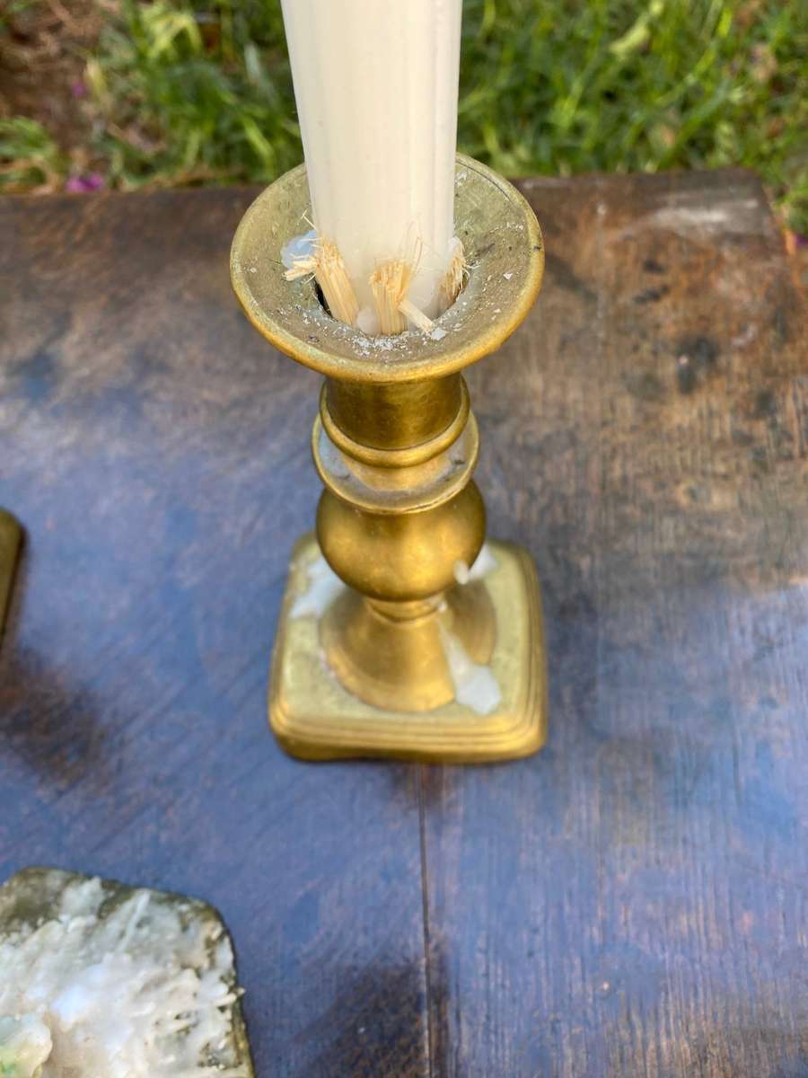 Three brass candle holders