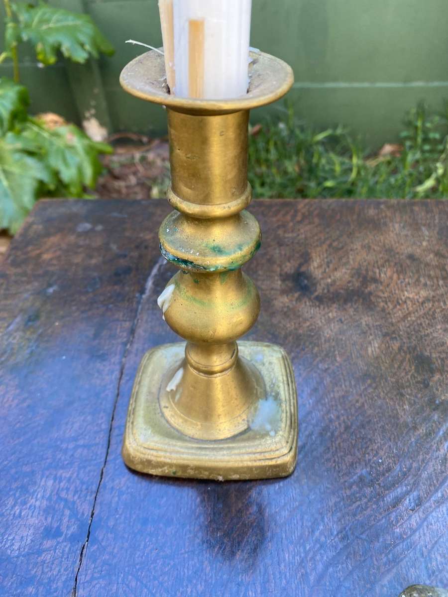 Three brass candle holders