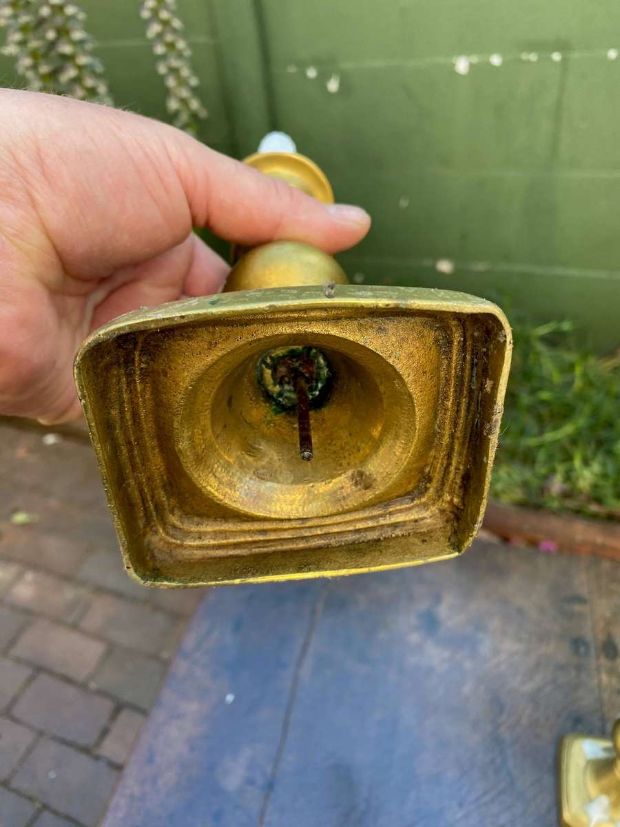 Three brass candle holders