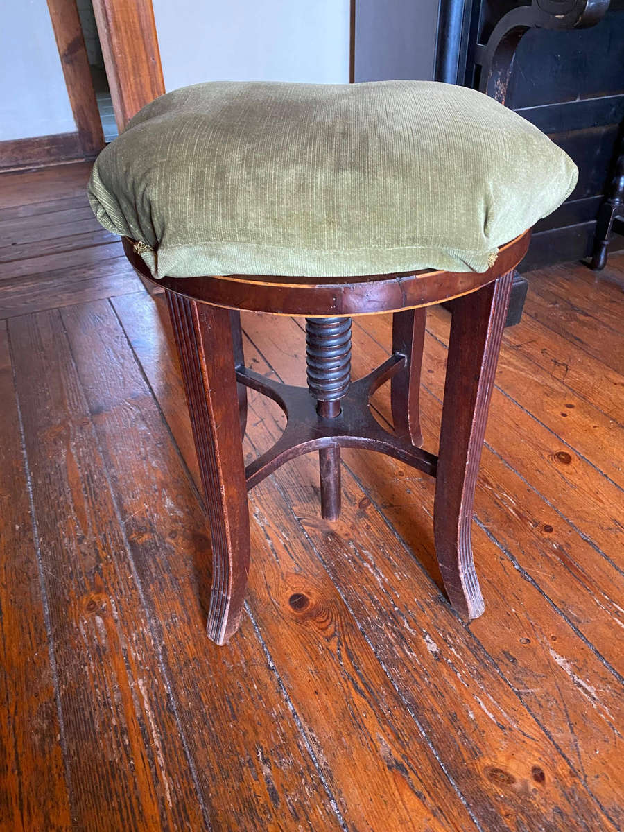 A Victorian mahogany adjustable circular piano stool