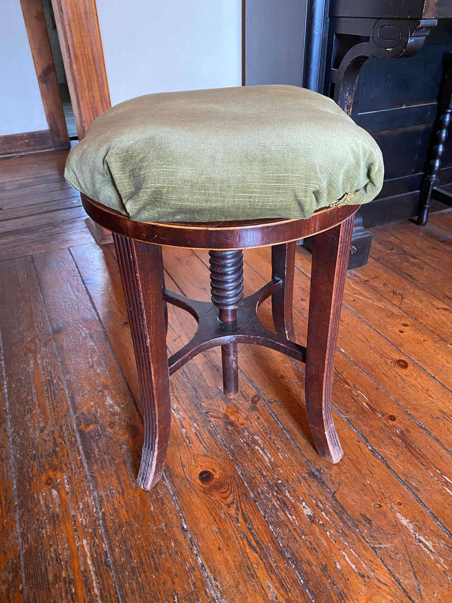 A Victorian mahogany adjustable circular piano stool