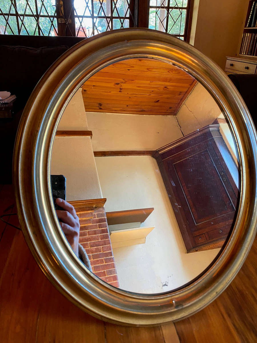 EDWARDIAN OVAL BRASS-FRAMED WALL MIRROR