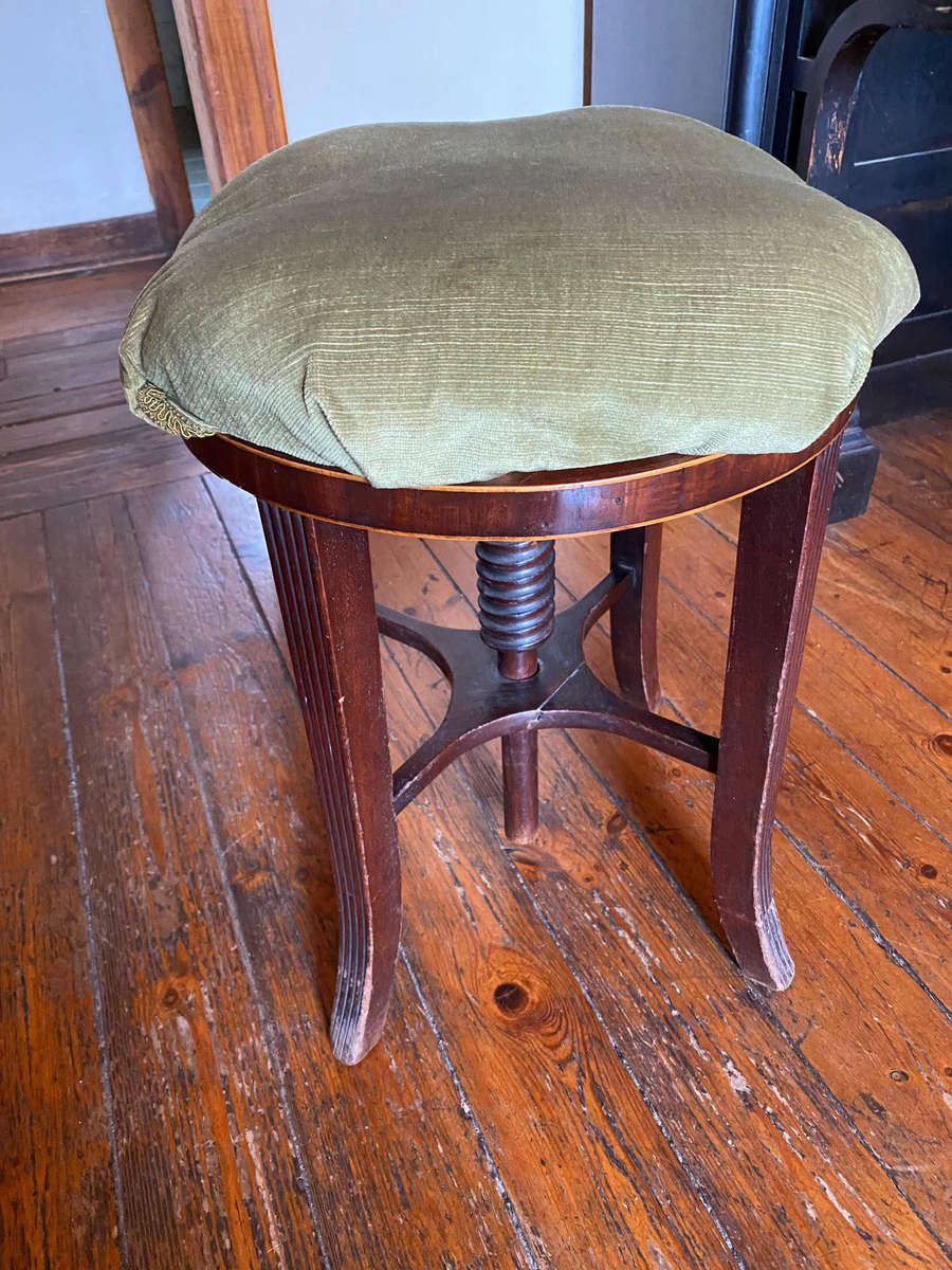 A Victorian mahogany adjustable circular piano stool