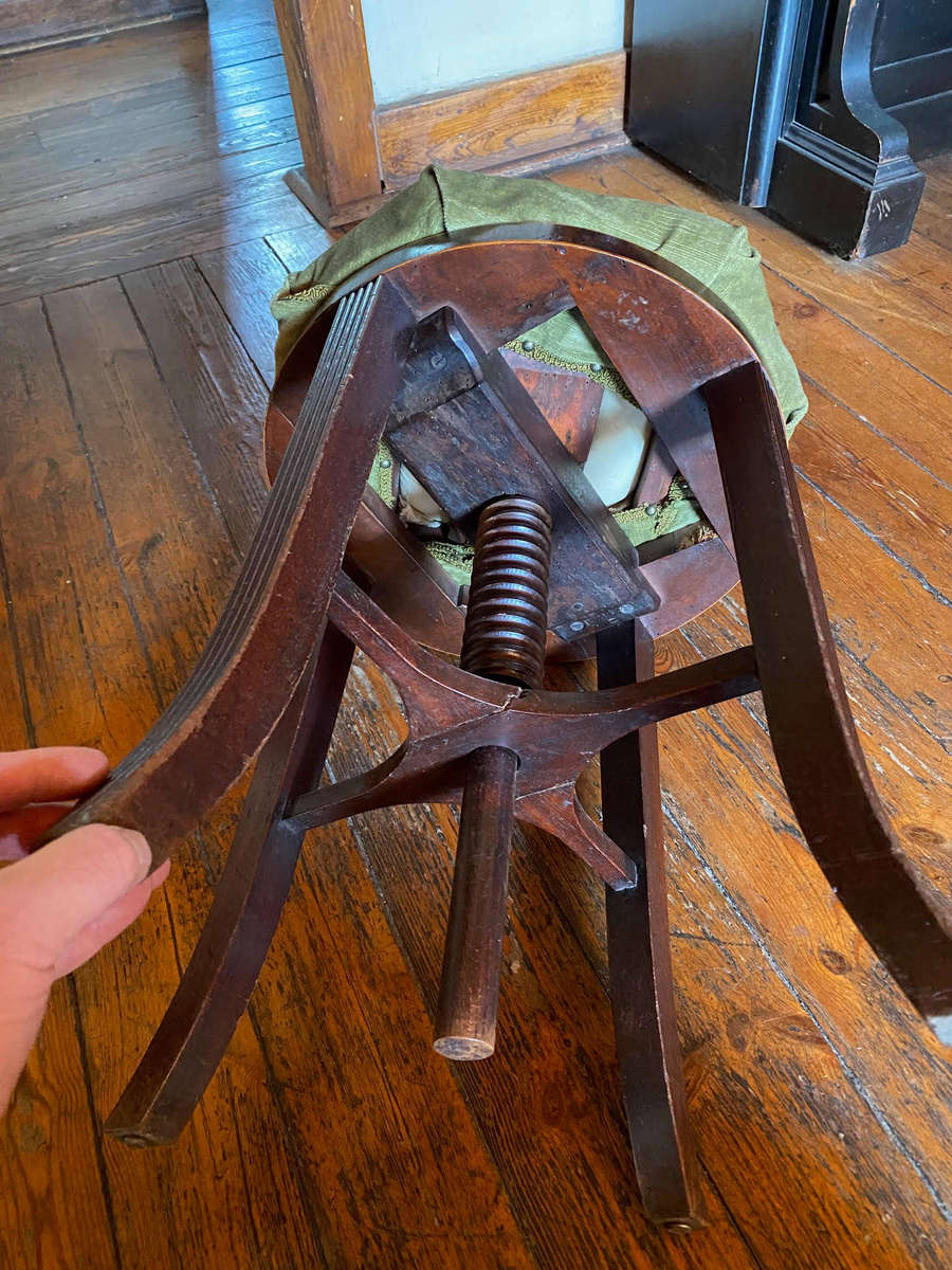 A Victorian mahogany adjustable circular piano stool