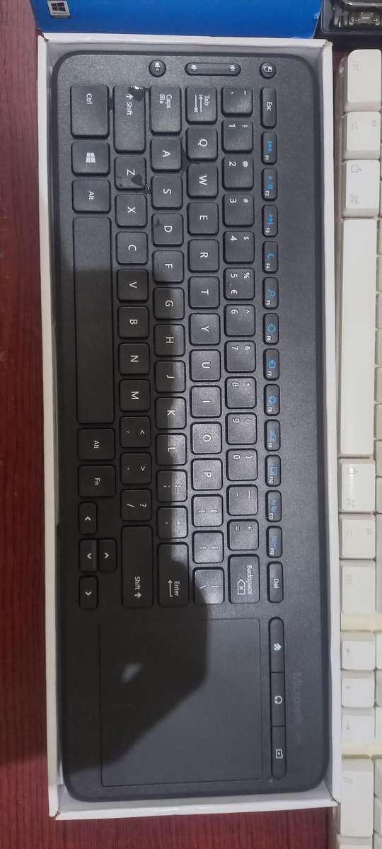 3x Apple Keyboards, 1x Mechanical Keyboard and Microsoft Keyboard with touchpad