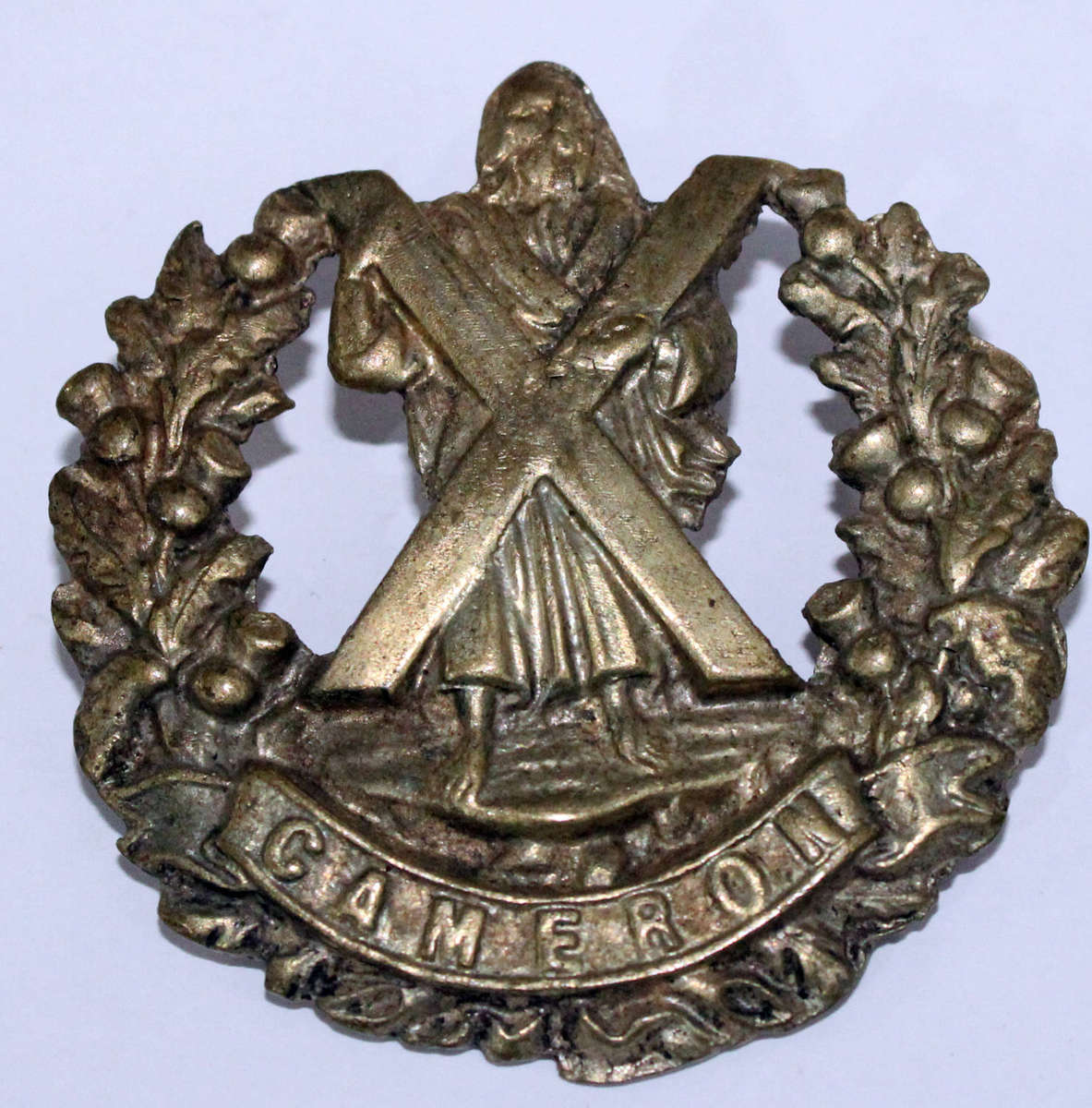 Cameron Highlanders cast cap badge