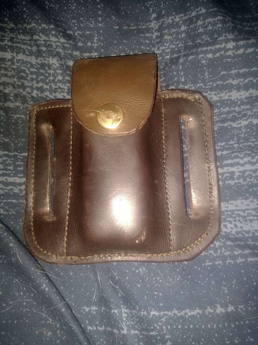 LEATHERMAN REBAR AND GENUINE LEATHER POUCH IN GOOD WORKING CONDITION.