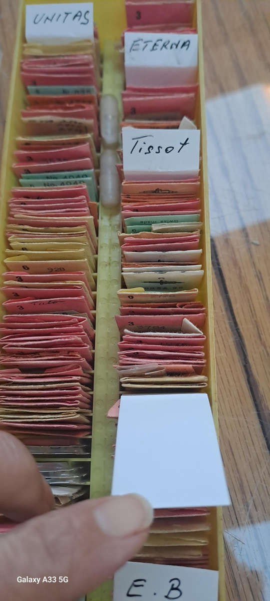 box of 100`s, sorted and originally packed new vintage watch balance staffs Reduced