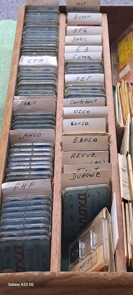 Huge selection of various vintage watch main springs