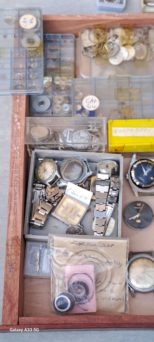 Draw full of various vintage watch movements and parts as per pictures