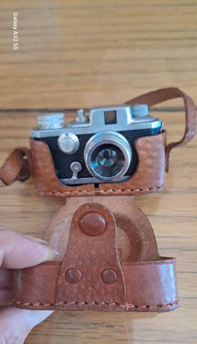 A Morita Kiku 16 Model II subminiature camera, within a leather case