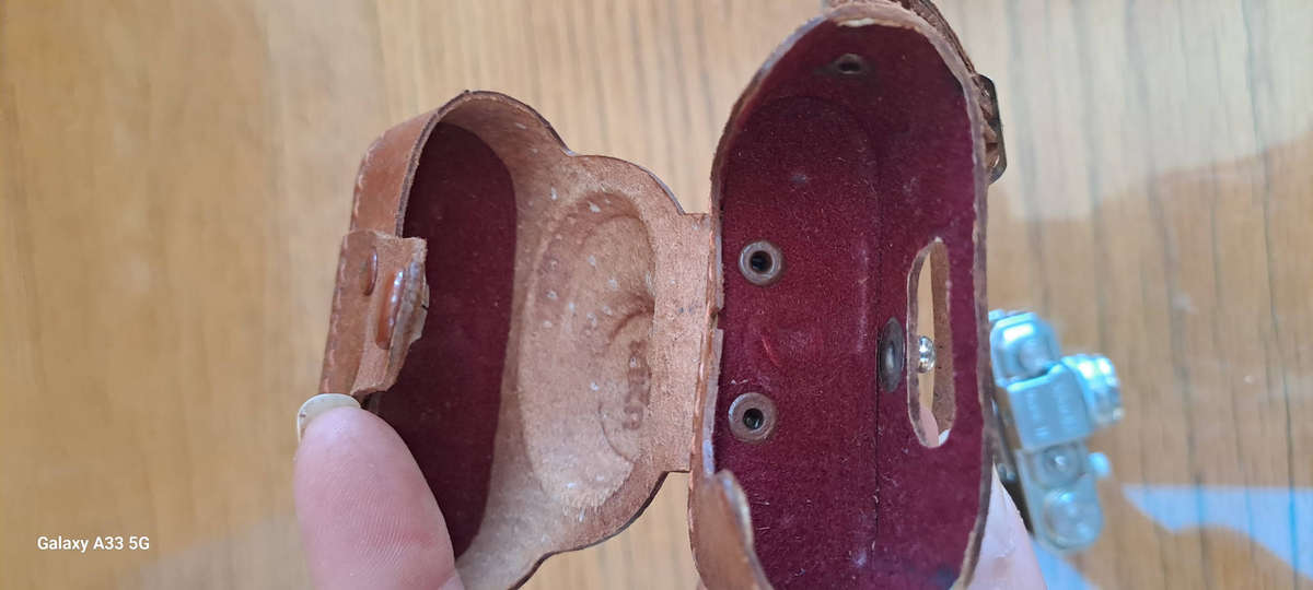 A Morita Kiku 16 Model II subminiature camera, within a leather case